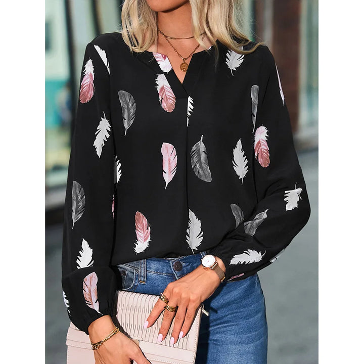 Nefeli | Elegante blouse met speelse verenprint