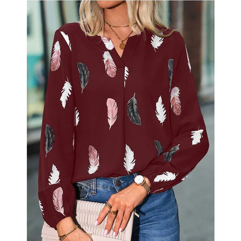 Nefeli | Elegante blouse met speelse verenprint