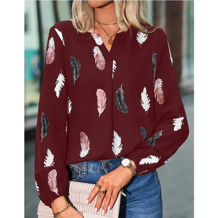 Nefeli | Elegante blouse met speelse verenprint